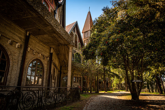 GONZALEZ CATAN, ARGENTINA, SEPTEMBER 28, 2019: cobblestone path through abandoned buildings in the amazing medieval town of Campanopolis, surrounded by forest.