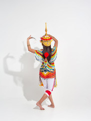 Back side of Young lady wearing Thai Tradition southern costume and headdress on her head,showing basic pattern folk dance,black shadow reflection on white background