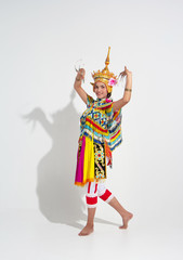 Young lady wearing Thai Tradition southern costume and headdress on her head,showing basic pattern folk dance,black shadow reflection on white background