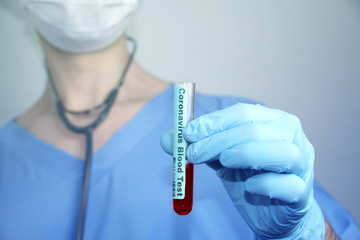 medical laboratory test tube with blood in the hand of a virologist doctor, concept of virology,...