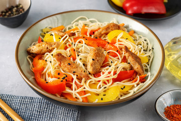 Close up of vegan stir fry noodels on light background