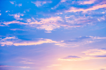 Obraz premium Blue, pink and orange sky with clouds.