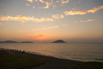 Sunset sea and sandy beach