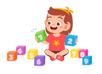 happy cute little kid girl play with block number