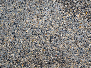 Gravel in a grey conrete 