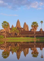 Angkor Wat, in Cambodia. Front general view of western facade at sunset with reflections. Angkor Wat is the largest religious monument in the world, and has been declared UNESCO World Heritage Site