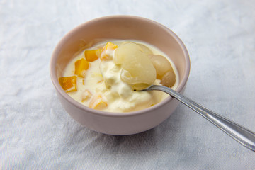 Garnished lychee and mango with vanilla ice cream