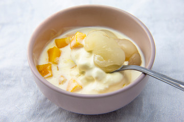 Garnished lychee and mango with vanilla ice cream