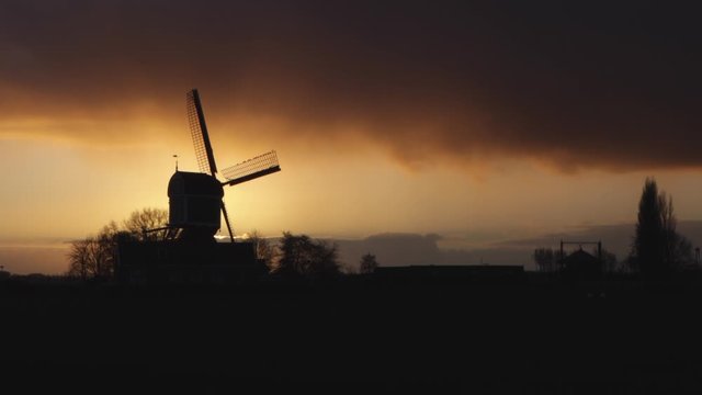 Old windmill at sunset in the Netherlands