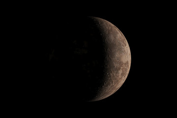 A little planet with light from the sun shining just a little from the right in the dark. 3D rendering