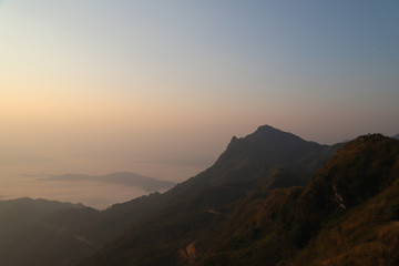 Scenery of fog sea and mountains with sunlight in the morning. 