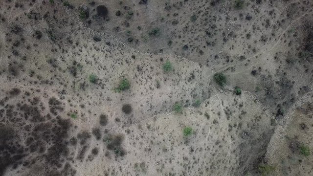 4K aerial drone summer day video African savanna and dry riverbeds surrounded by bush covered hills in Daan Viljoen National Game Park in Khomas Hochland area near Windhoek, Namibia's capital, Africa