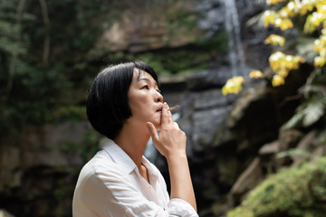 traveling woman smoking and resting