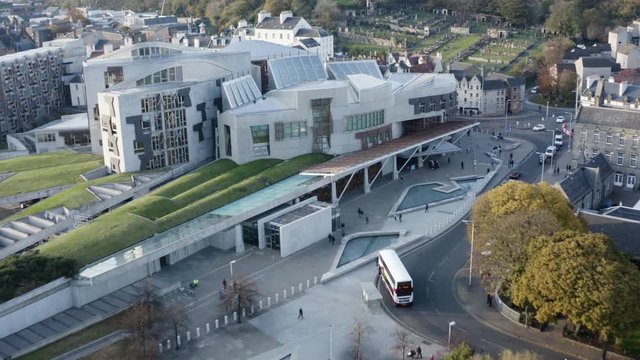 Cinematic zoom out from Holyrood Scottish Parliament to show surrounding area | Edinburgh, Scotland | 4K at 30fps