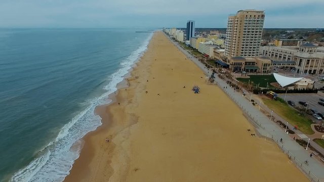 Drone, Aerial of beach and Neptune statue on overcast day in Virginia Beach