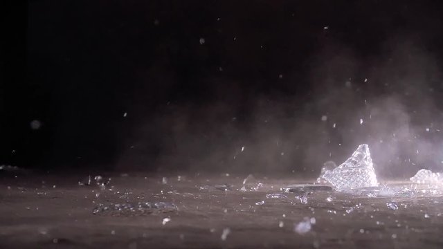 Glass breaking in slow-motion not centered.