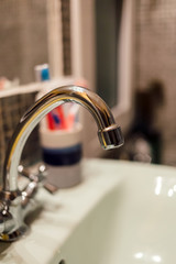 metal faucet at wash basin, Interior of bathroom - close up