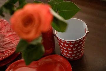Fototapeta premium Valentines hearts, candy, and flowers. Motion blur movements and flowers on a vase.