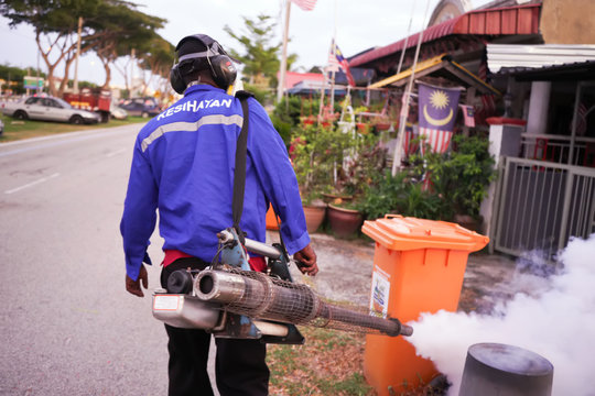 Selangor, Malaysia - 13 February 2020 : health workers are doing the job of spraying mosquit