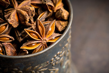 Dried anise stars on the rustic background. Selective focus. Shallow depth of field.