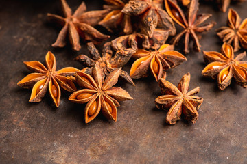 Dried anise stars on the rustic background. Selective focus. Shallow depth of field.