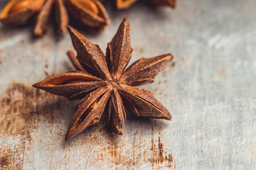 Dried anise stars on the rustic background. Selective focus. Shallow depth of field.