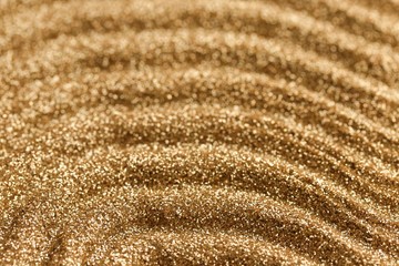 Gold pattern. Golden shine stripes pattern.Art deco glitter background.shiny gold texture.Glitter macro shimmer texture. background with twinkle lights.