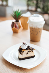 oreo cookies and cream cheese cake, biscuits eaten together with cold cappuccino on the back