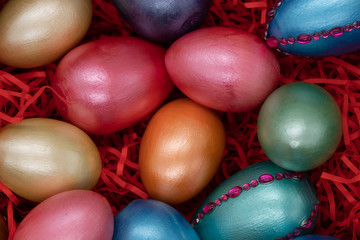 color easter eggs in basket isolated on white