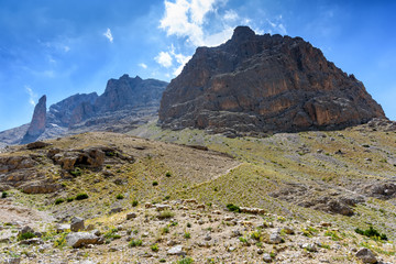 Mountain landscape with sheep in the Turkish national Park aladag in summer day