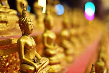 Golden statue of buddha in temple, Thailand	