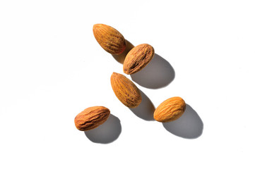 peeled almonds on a white background. view from above.