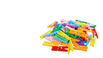 Mini colored clothespins. Isolated on white background.