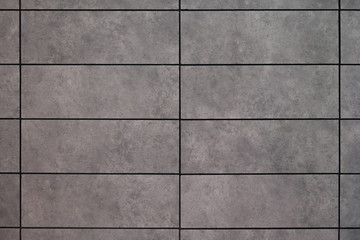 Wall texture and gray block pattern are suitable for a simple design background.