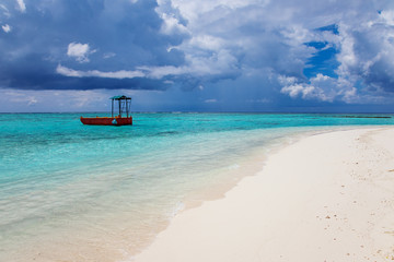 Obraz premium Turquoise blue sea water shore and cloudy sky