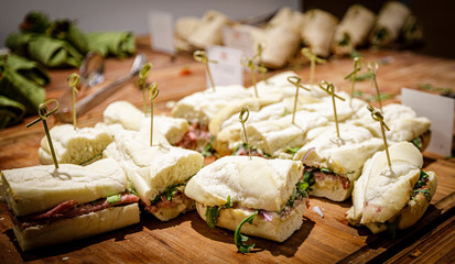 Assorted sandwiches and wraps, smoked meat, roast beef, vegetarian