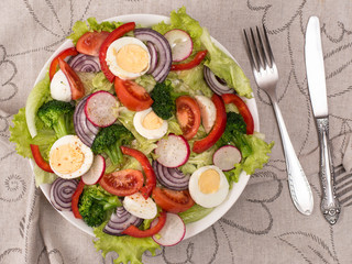 fresh salad of vegetables and herbs.