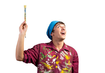 Smiling young painter artist holding paintbrush