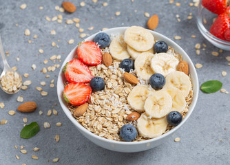 Homemade oatmeal granola with strawberries, blueberry and banana. Healthy breakfast