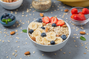 Homemade oatmeal granola with strawberries, blueberry and banana. Healthy breakfast