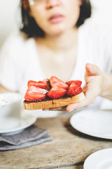 woman holding sliced bread. 