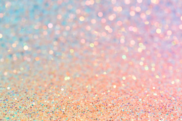 Delicate shiny texture, pastel pink and yellow glitter, abstract blurred background