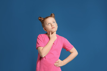 Portrait of emotional girl on blue background