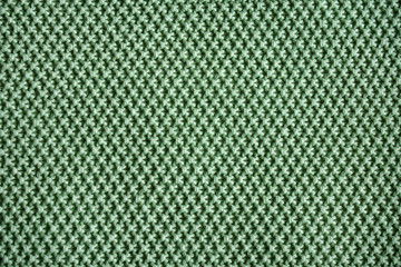 Close up to texture of green fabric wallpaper.