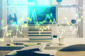 Financial chart drawing and table with computer on background. Multi exposure. Concept of international markets.