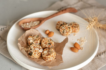 Raw vegan healthy dessert, date and nuts bliss balls, ingredients. Top view, space for text.