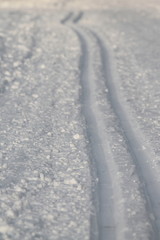 Ski track in snow , active winter holiday concept.