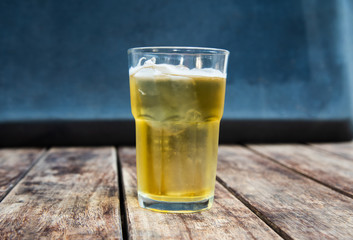 Beer in glass on wooden table drinking concept.