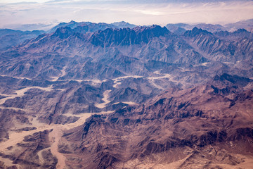 Aerial view of mountains in the Sinai through an airplane window