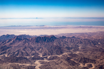 Aerial view of mountains in the Sinai through an airplane window